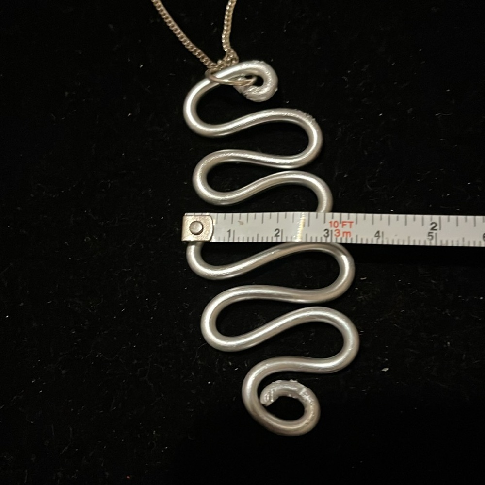 Elegant Silver Wave Hand Design Necklace - Picture 17 of 17
